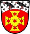 Gules, a cross paty quadrate or, charged with five mullets of six points gules: a chief arched ermine charged with two Cornish choughs proper - Vickers, England