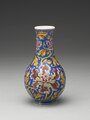 Gallbladder-shaped vase decorated with peony on a blue ground in painted enamels, Qing dynasty, Kangxi period (1662–1722). National Palace Museum.