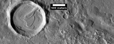 Layered feature in crater, as seen by HiRISE under HiWish program