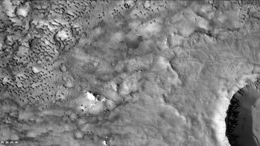 Dunes on floor of Baldet Crater, as seen by CTX camera (on Mars Reconnaissance Orbiter). Many craters on Mars have sand dunes on their floors. This is a result of the thin atmosphere not having sufficient power to push sand grains up and over the crater wall. Note: this is an enlargement of a previous image of Baldet Crater.