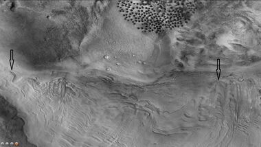 Dunes and old glaciers in Renaudot Crater, as seen by CTX camera (on Mars Reconnaissance Orbiter). Arrows point to old glaciers along the crater wall.