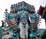 Photo of a statue with many heads and many arms