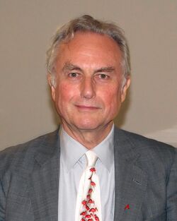 Photo of a man with gray hair wearing a suit