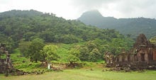 Wat Phou: from left, the south palace, the tiers leading to the central sanctuary, the mountain peak shrouded in mist, and the north palace.