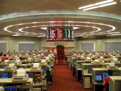 Large, empty room, with many desks and computer terminals