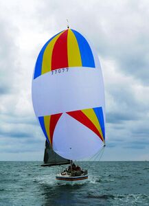Symmetric spinnaker while running downwind, primarily generating drag.