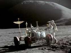 Astronaut works on the Moon at the lunar rover