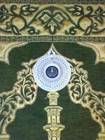 A prayer mat with a compass
