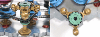 A spintronic 55 H inductor. The spintronic inductor has three heavy weights attached to the outside of rotating sprockets. This makes the current change slowly when the voltage applied to it is changed abruptly.