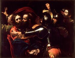 Judas kisses Jesus, and soldiers rush to seize the latter.