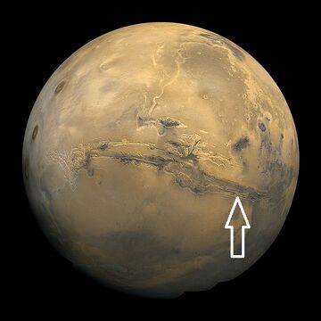 Image of disk of Mars taken by Viking. Arrow shows location of recurrent slope lineae in following HiRISE images.