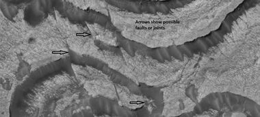 Faults and layers in Firsoff Crater, as seen by HiRISE under HiWish program. Arrows show location of faults.