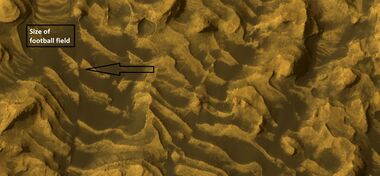 Enlargement of previous image showing a fault and layers. Image taken with HiRISE, under HiWish program.