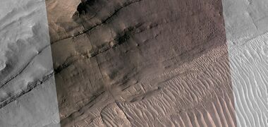 Close view of layers, as seen by HiRISE under HiWish program Part of picture is in color. A ridge cuts across the layers at a right angle.