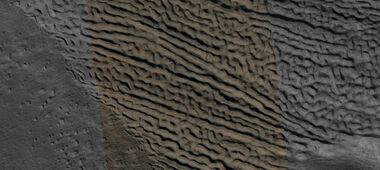 Close view of lineated valley fill (LVF) in valley, as seen by HiRISE under HiWish program. Linear valley flow is ice covered by debris. Lineated valley fill is generally considered to be and example of a glacier, as it involves the movement of ice.