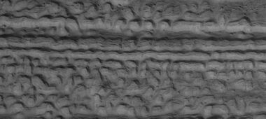 Close view of lineated valley fill (LVF) in valley, as seen by HiRISE under HiWish program. Linear valley flow is ice covered by debris. Lineated valley fill is generally considered to be and example of a glacier, as it involves the movement of ice.