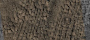 Close view of lineated valley fill (LVF) in valley, as seen by HiRISE under HiWish program. Linear valley flow is ice covered by debris. Picture is about 1 km wide. Lineated valley fill is generally considered to be and example of a glacier, as it involves the movement of ice.