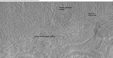 Close-up of lobate debris apron from the previous CTX image of a mesa. Image shows open-cell brain terrain and closed-cell brain terrain, which is more common. Open-cell brain terrain is thought to hold a core of ice. Image is from HiRISE under HiWish program.