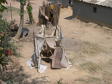 Unimproved sanitation example: pit latrine without slab in Lusaka, Zambia