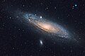 A visible light image of the Andromeda Galaxy and two satellite galaxies. Messier 32 is above the galactic nucleus and Messier 110 is at the bottom.