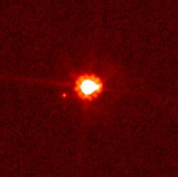 Eris (center) and Dysnomia (left); image taken by the Hubble Space Telescope