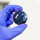 Sample of a spherically carved and polished fluorite via lapidary, a form commonly associated with decorative uses.