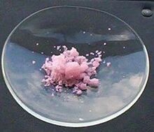 Erbium(III) chloride hydrate photographed in sunlight