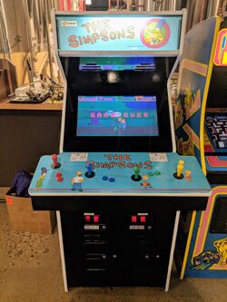 A blue arcade game with The Simpsons characters on it