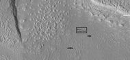 Arrows point to drumlin-like shapes that were probably formed under a glacier, as seen by HiRISE, under HiWish program.