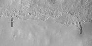 Close view of mantle, as seen by HiRISE under HiWish program Arrows show craters along edge which highlight the thickness of mantle.