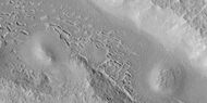 Hollows in surface, formed as ice is removed from ground, as seen by HiRISE under HiWish program.