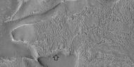 Brain terrain with a view from the side, as seen by HiRISE under HiWish program Arrow shows where a side view of the brain terrain is visible.