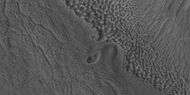 Close view of contact, as seen by HiRISE under HiWish program Picture shows details of how upper plains material is breaking. The formation of many fractures seems to precede the break up.