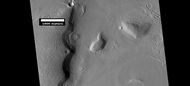 Layered features, as seen by HiRISE under HiWish program On the right side of picture a small region of ribbed upper plains material is changing into brain terrain.