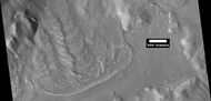 Glacier coming out of valley, as seen by HiRISE under HiWish program Location is rim of Moreux Crater.