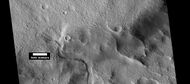 Channel that has cut through a crater rim, as seen by HiRISE under HiWish program