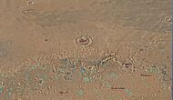 Map of Ismenius Lacus quadrangle which is located just north of Arabia, a large bright area of Mars. It contains large amounts of ice in glaciers that surround hills.