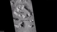 Wide CTX view showing mesa and buttes with lobate debris aprons and lineated valley fill around them. Location is Ismenius Lacus quadrangle.