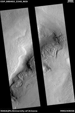 Wide view of dipping layers, as seen by HiRISE under the HiWish program. The dark strip is where a computer problem is preventing the gathering of data.
