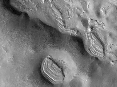 Several sets of dipping layers This image was named HiRISE picture of the day.
