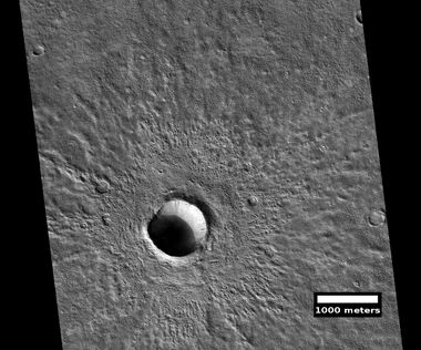 Fresh crater, as seen by HiRISE under HiWish program This is a young crater because one can easily see the rim and ejecta. They have not yet been eroded.