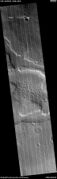Wide view of honeycomb shapes and possible dikes that make an "X" shape, as seen by HiRISE under HiWish program