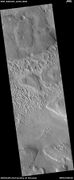 Wide view of terrain caused by ice leaving the ground, as seen by HiRISE under HiWish program
