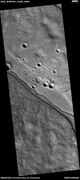 Channel within larger channel, as seen by HiRISE under HiWish program The existence of the smaller channel suggests water went through the region at least two times in the past.