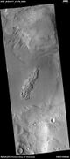 Wide view showing light-toned feature that is breaking into blocks, as seen by HiRISE under HiWish program