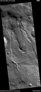 Channels, as seen by HiRISE under HiWish program These channels are near the ejecta of a crater; hence, they may have formed from warm ejecta melting ground ice.