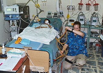 US Army ICU nurse attending to a patient in Baghdad, Iraq