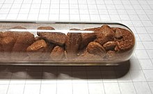 Thullium(III) iodide crystals in glass ampoule.jpg
