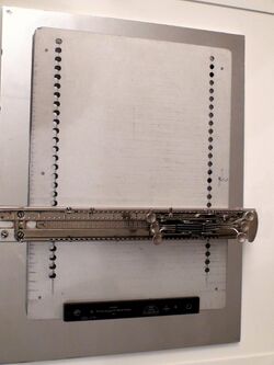 sliding carriage with keys on a metal plate
